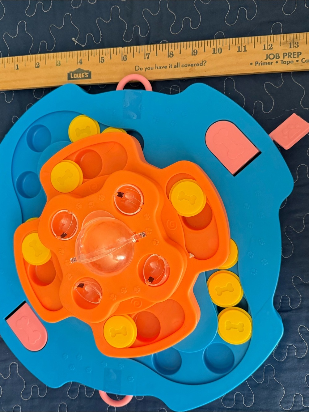 Pet toy: Pop-and-Sort Stackable Puzzle Toy hides treat and pet seeks them.